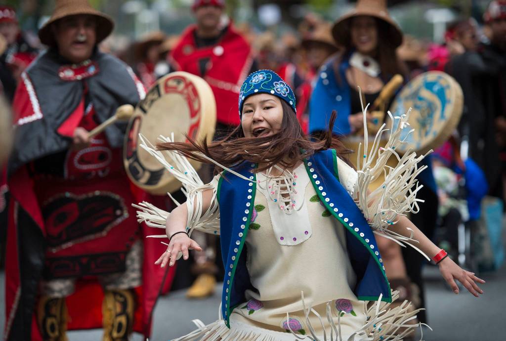 Donna Jim, of the Taku Kwaan Dancers, of Atlin, BC, dances through downtown Juneau on Saturday, June 9, 2018, the last day of Celebration 2018. (Michael Penn | Juneau Empire)