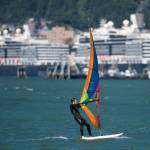 Greg Albricht takes advantage of a steady breeze to windsurf downtown on Monday, July 30, 2018. (Michael Penn | Juneau Empire)