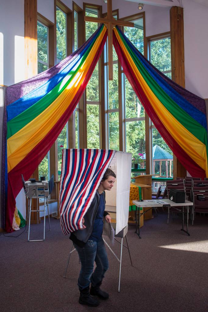 Maisi MacCabe exits a voting booth at Aldersgate United Methodist Church on Election Day, Tuesday, Nov. 6, 2018. (Michael Penn | Juneau Empire)