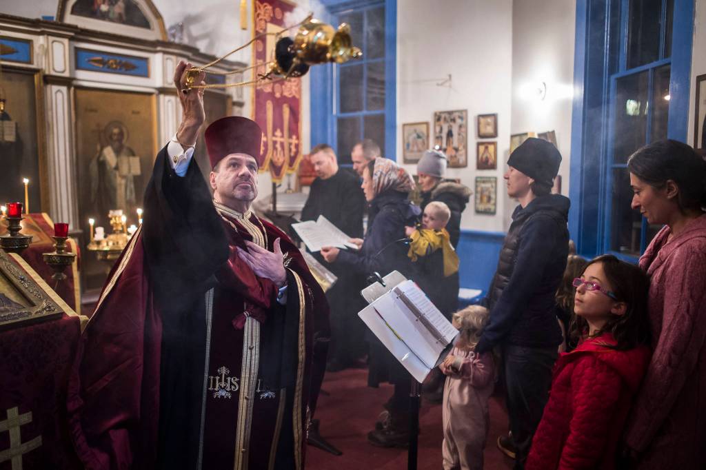 Rev. Steven F. McGuigan, Rector of the St. Nicholas Russian Orthodox Church, performs a Festal Vespers service to celebrate on the eve of Saint Nicholas Day on Wednesday, Dec. 5, 2018. The Cathedral of the Nativity of the Blessed Virgin Mary hosted a recepton for the congregation in St. Anns Parish Hall after the service. (Michael Penn | Juneau Empire)