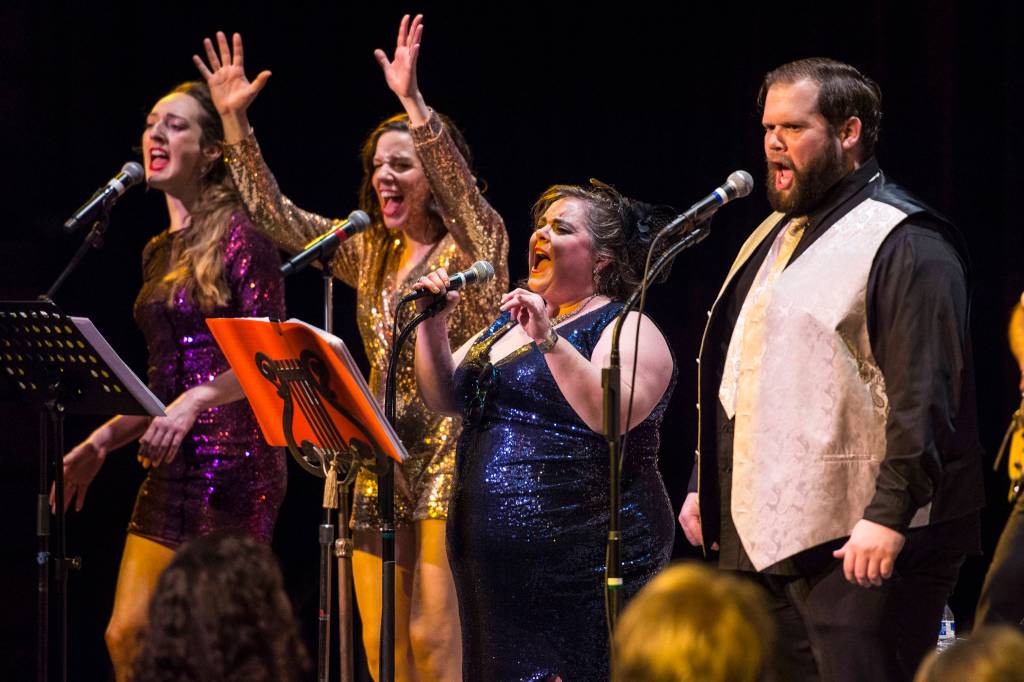 Taylor Vidic, left, Allison Holtkamp, Collette Costa, Mike Gamble, right, perform as Gamble & High Costa Livin during the New Years Eve Gala at Centennial Hall on Monday, Dec. 31, 2018. The event was a fundraiser for the Juneau Arts and Humanities Council and Juneau Jazz & Classics. (Michael Penn | Juneau Empire)