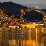 A Channel Construction barge is loaded with scrapped metal in Gastineau Channel on Friday, Jan. 4, 2019. (Michael Penn | Juneau Empire)