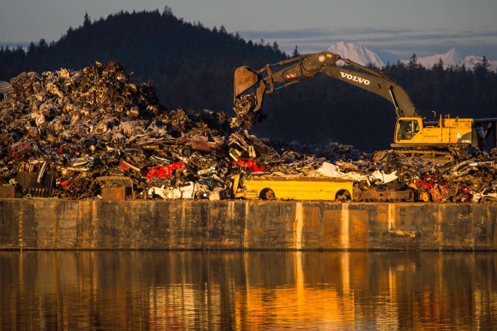 A Channel Construction barge is loaded with scrapped metal in Gastineau Channel on Friday, Jan. 4, 2019. (Michael Penn | Juneau Empire)