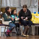 Jordan Kendall sits with his daughter, Neeka, 10, center, and Isabel Danner, 11, as they taste cookies and Coppa ice cream made with Girl Scout cookies during a Cookie Rally at the Juneau Arts & Culture Center on Friday, Jan. 11, 2019. The rally kicks off the first day of selling cookies for the Girl Scouts. (Michael Penn | Juneau Empire)