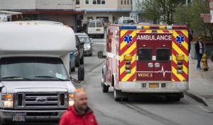 A Capital City Fire/Rescue crew transports a cruise ship passenger downtown on Tuesday, August 14, 2018. (Michael Penn | Juneau Empire)