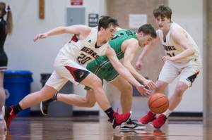 Juneau-Douglas Cooper Kriegmont, left, attempts a steal against Colonys Sullivan Menard at JDHS on Thursday, Jan. 10, 2019. Colony won 66-40. (Michael Penn | Juneau Empire)
