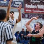Thunder Mountains Kamron Falls, left, shoots against Colonys Wyatt Baker at TMHS on Friday, Jan. 11, 2019. Colony won 46-27. (Michael Penn | Juneau Empire)