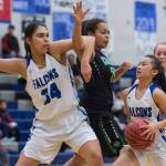 Thunder Mountains Mary Khaye Garcia, right, takes advantage of a pick against Colonys Kali Bull by teammate Kira Frommherz at TMHS on Friday, Jan. 11, 2019. Colony won 58-28. (Michael Penn | Juneau Empire)