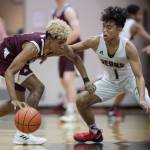 Juneau-Douglas Israel Yadao, right, guards against Ketchikans Marcus Lee at JDHS on Friday, Jan. 11, 2019. JDHS won 75-67. (Michael Penn | Juneau Empire)