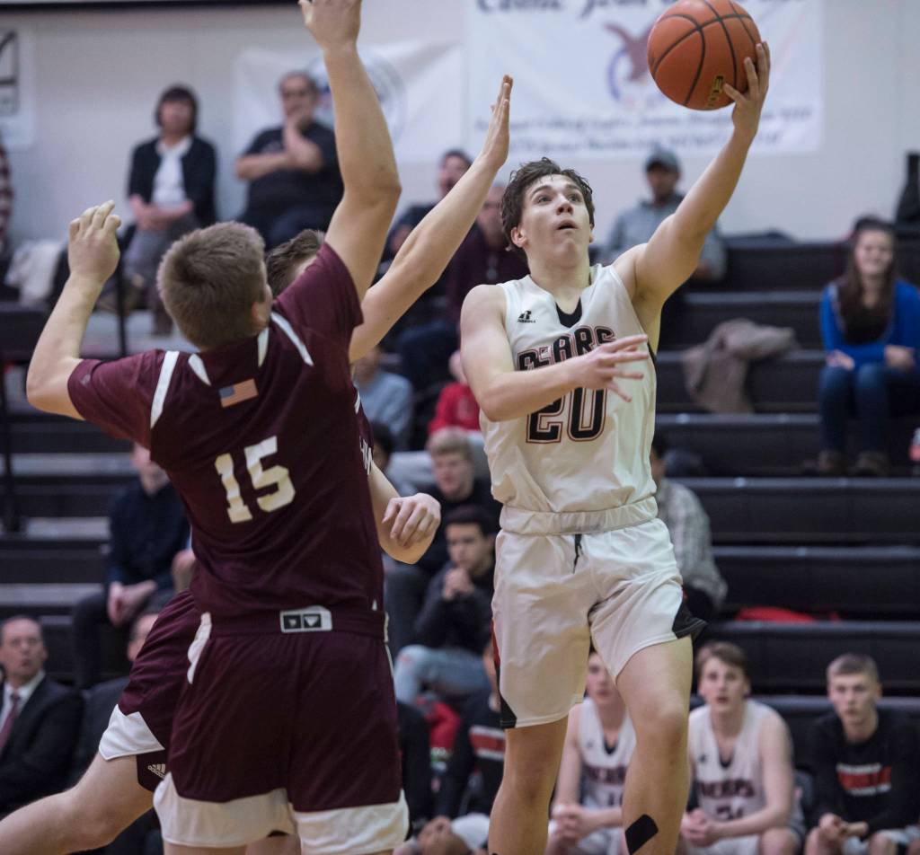 Juneau-Douglas Cooper Kriegmont lays the ball up against Ketchikan at JDHS on Friday, Jan. 11, 2019. JDHS won 75-67. (Michael Penn | Juneau Empire)