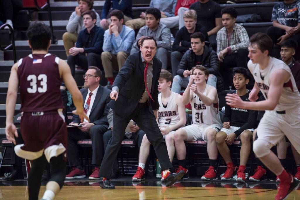 Juneau-Douglas Coach Robert Casperson yells instructions to his team against Ketchikan at JDHS on Friday, Jan. 11, 2019. JDHS won 75-67. (Michael Penn | Juneau Empire)
