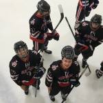 Juneau-Douglas High School hockeys Ronan Lynch, left bottom, and Bill Bosse, right, smile at the Polar Ice Arena in North Pole. (Courtesy Photo | Matt Boline)