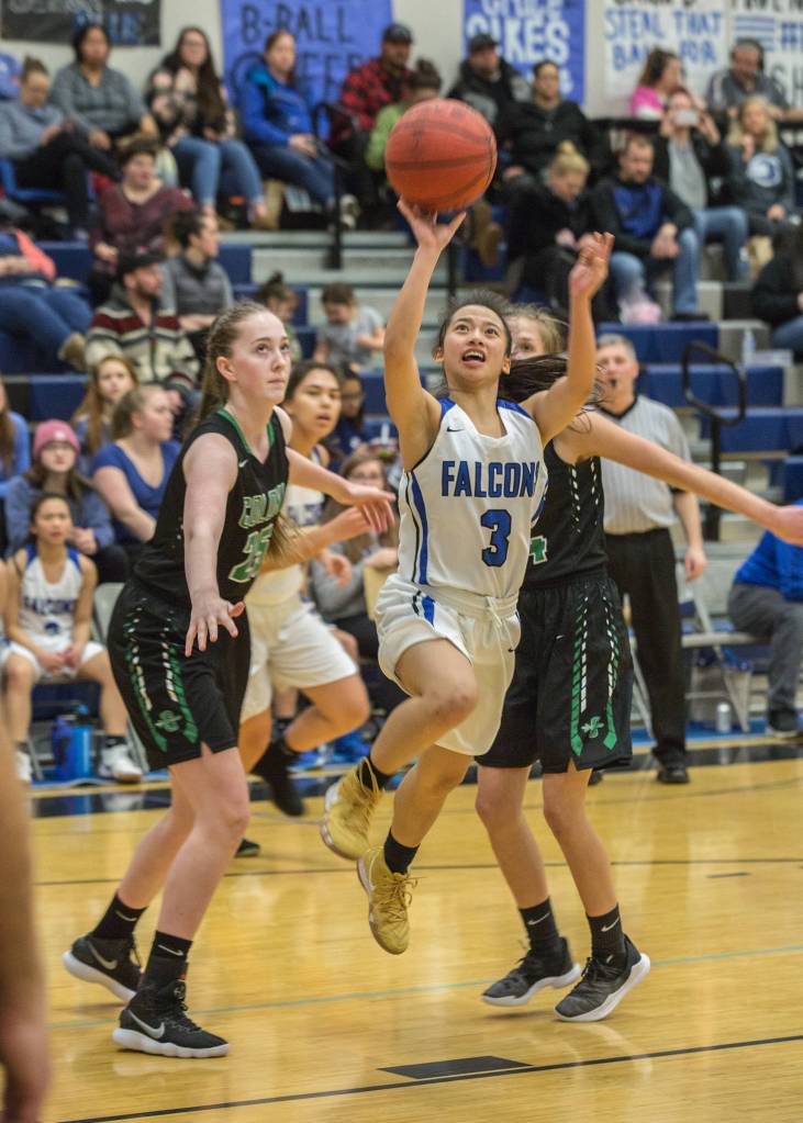 Thunder Mountain sophomore Mary Neal Garcia goes up for the layup against Colonys Tori Schwantes, left, and Maggie Spencer at Thunder Mountain High School on Saturday, Jan. 12. 2019. (Courtesy Photo | Heather Holt)