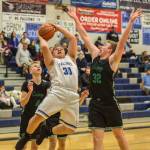 Thunder Mountain senior Vaipuna Toutaiolepo takes the shot in the key against Colonys Colton Spencer, left, and Wyatt Baker, right, at Thunder Mountain High School on Saturday, Jan. 12, 2019. (Courtesy Photo | Heather Holt)