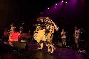 Gene Tagaban performs with Khu.Eéx while wearing regalia. The band will play in Juneau Monday, Jan. 28 at Centennial Hall. (Courtesy Photo | Russell Johnson)