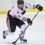 Juneau-Douglas Bill Bosse moves the puck against Homer at Treadwell Arena on Friday, Jan. 18, 2019. JDHS won 4-3 in overtime. (Michael Penn | Juneau Empire)
