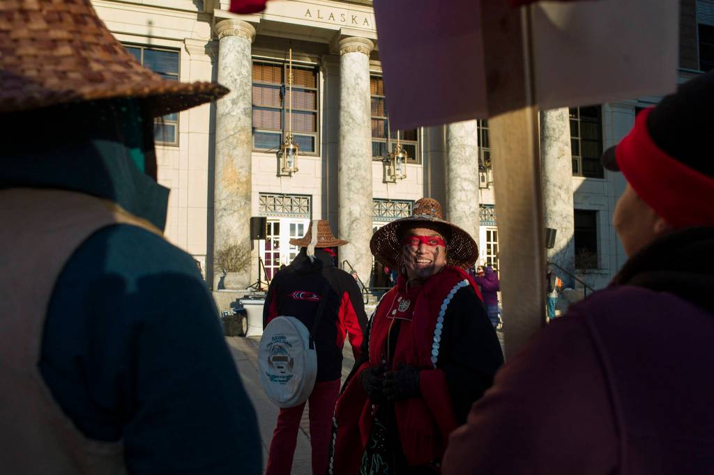 Nancy Keen attends with Native women holding up red dresses to symbolise missing and murdered indigenous women during the Womens March on Juneau in front of the Alaska State Capitol on Saturday, Jan. 19, 2019. (Michael Penn | Juneau Empire)