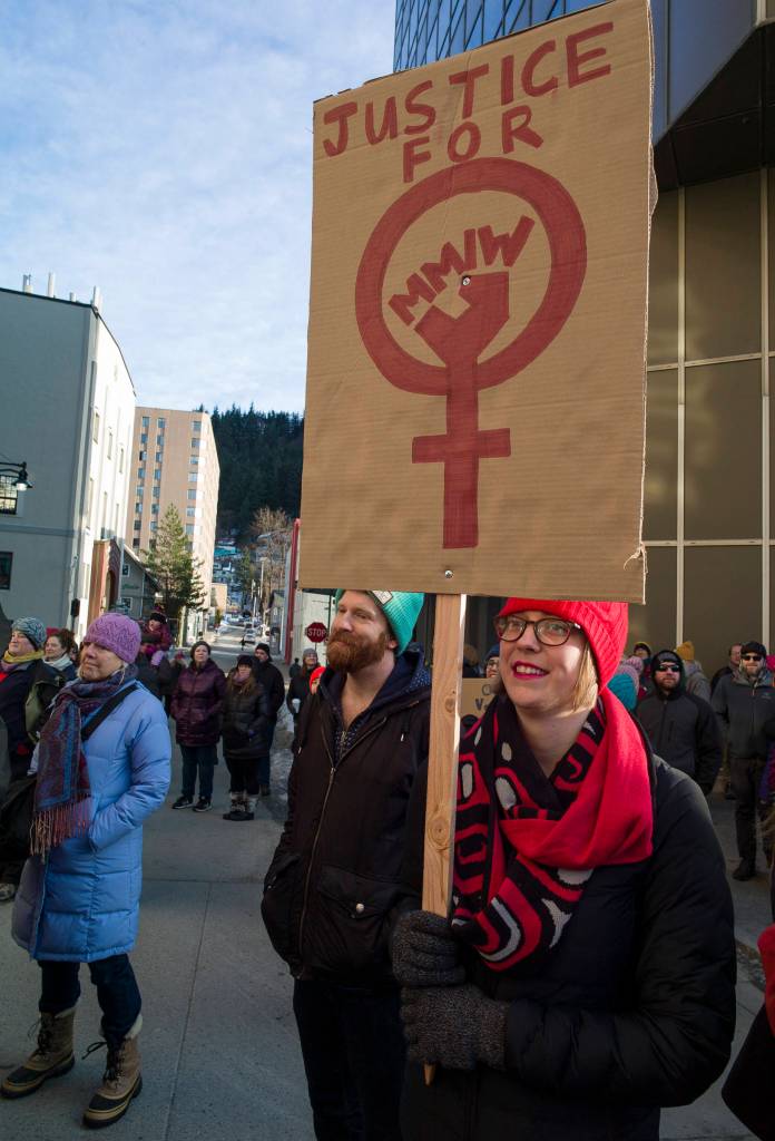 City and Borough of Juneau Assembly member Carole Triem holds a sign at the Womens March on Juneau in front of the Alaska State Capitol on Saturday, Jan. 19, 2019. (Michael Penn | Juneau Empire)