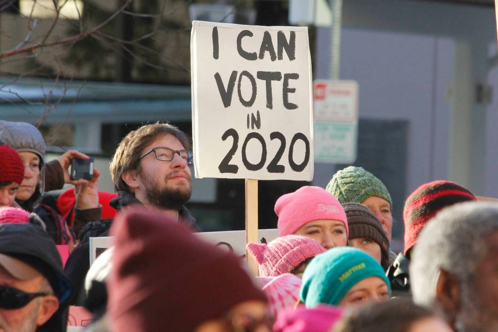 Attendees hold up signs at Juneaus Womens March on Saturday, Jan. 19, 2019. (Alex McCarthy | Juneau Empire)