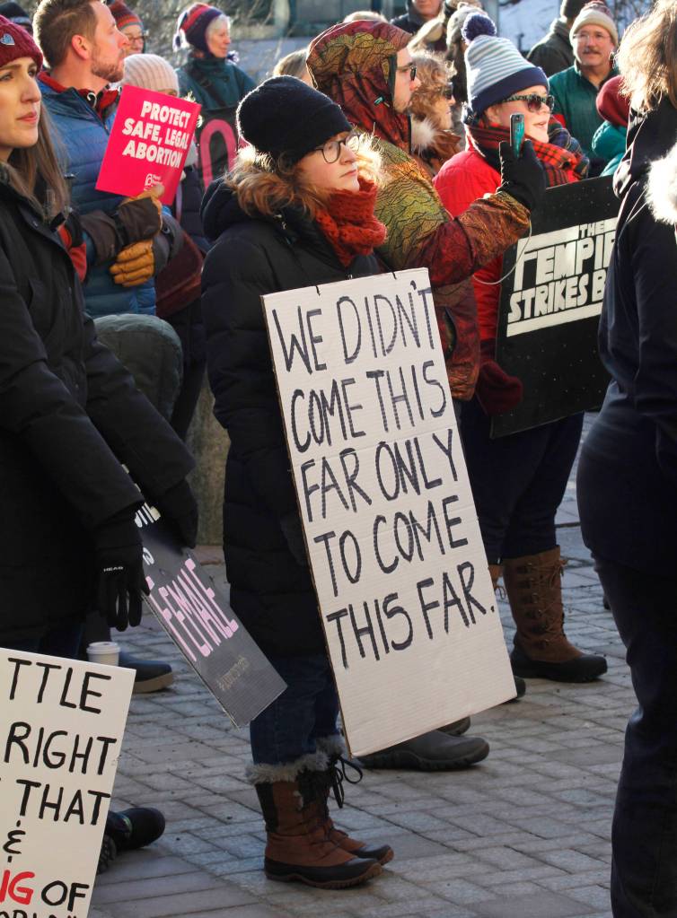 Attendees hold up signs at Juneaus Womens March on Saturday, Jan. 19, 2019. (Alex McCarthy | Juneau Empire)