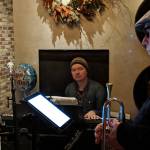 Luke Weld sits behind his keyboard and Greg Kalbaugh readies to play trumpet before the Juneau Fives regular Thursday Night Jazz show at the Narrows Bar, Jan. 31, 2019. (Ben Hohenstatt | Juneau Empire)