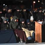 Alaska Police and Fire Chaplain Diane Peterson leads a candlelight vigil at the Mayor Bill Overstreet Park for the Guardian medical flight crew that went missing this week. (Michael Penn | Juneau Empire)