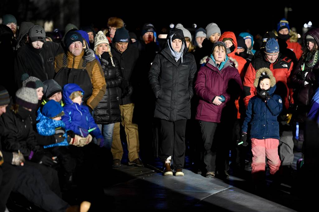 Hundreds of Juneau residents turnout Friday, Feb. 1, 2019, in 8-degree weather for a candlelight vigil at Mayor Bill Overstreet Park for the Guardian medical flight crew that went missing this week. (Michael Penn | Juneau Empire)