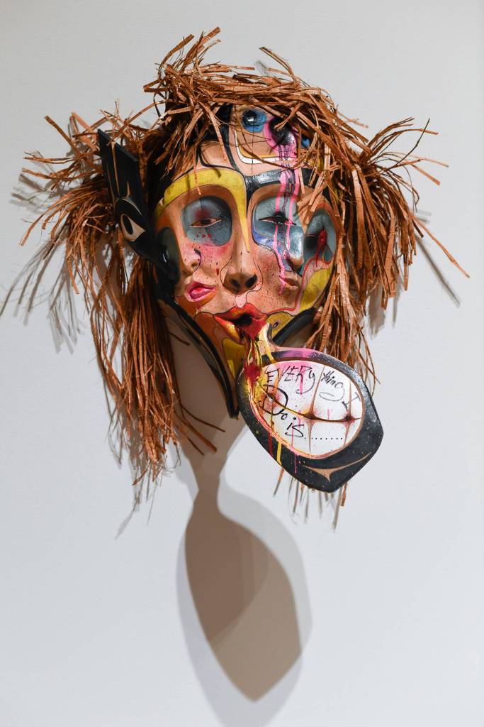 Donald Varnell mask titled Xuux is made of red and yellow cedar, alder, spray paint, acrylic, watercolor, red cedar bark, zip ties and wood glue is on display at the Alaska State Museum on Friday, Feb. 1, 2019. (Michael Penn | Juneau Empire)
