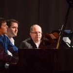 Kyle Farley-Robinson, left, Jon Hays, center, and Dr. Alexander Tutunov play Romance And Waltz For Six Hands Piano by Sergei Rachmaninoff during the Juneau Piano Series featuring Dr. Tutunov at the Juneau Arts & Culture Center on Friday, Jan. 18, 2019. (Michael Penn | Juneau Empire)