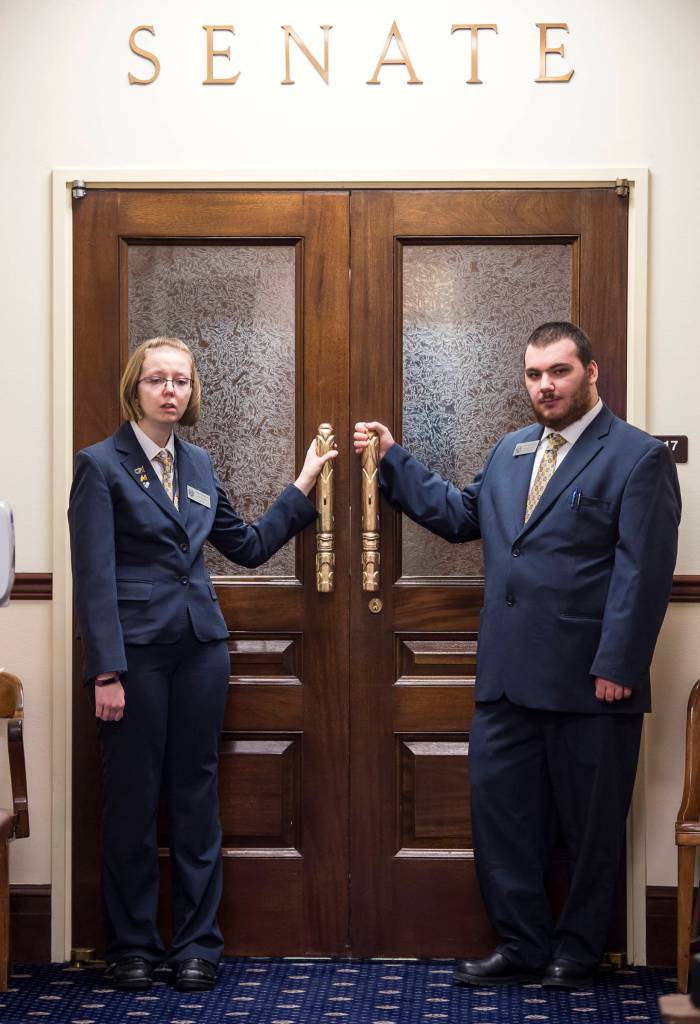 Senate Pages Sydney Krebsbach, left, and Matthew Puckett dressed for work at the Capitol on Wednesday, Jan. 23, 2019. (Michael Penn | Juneau Empire)