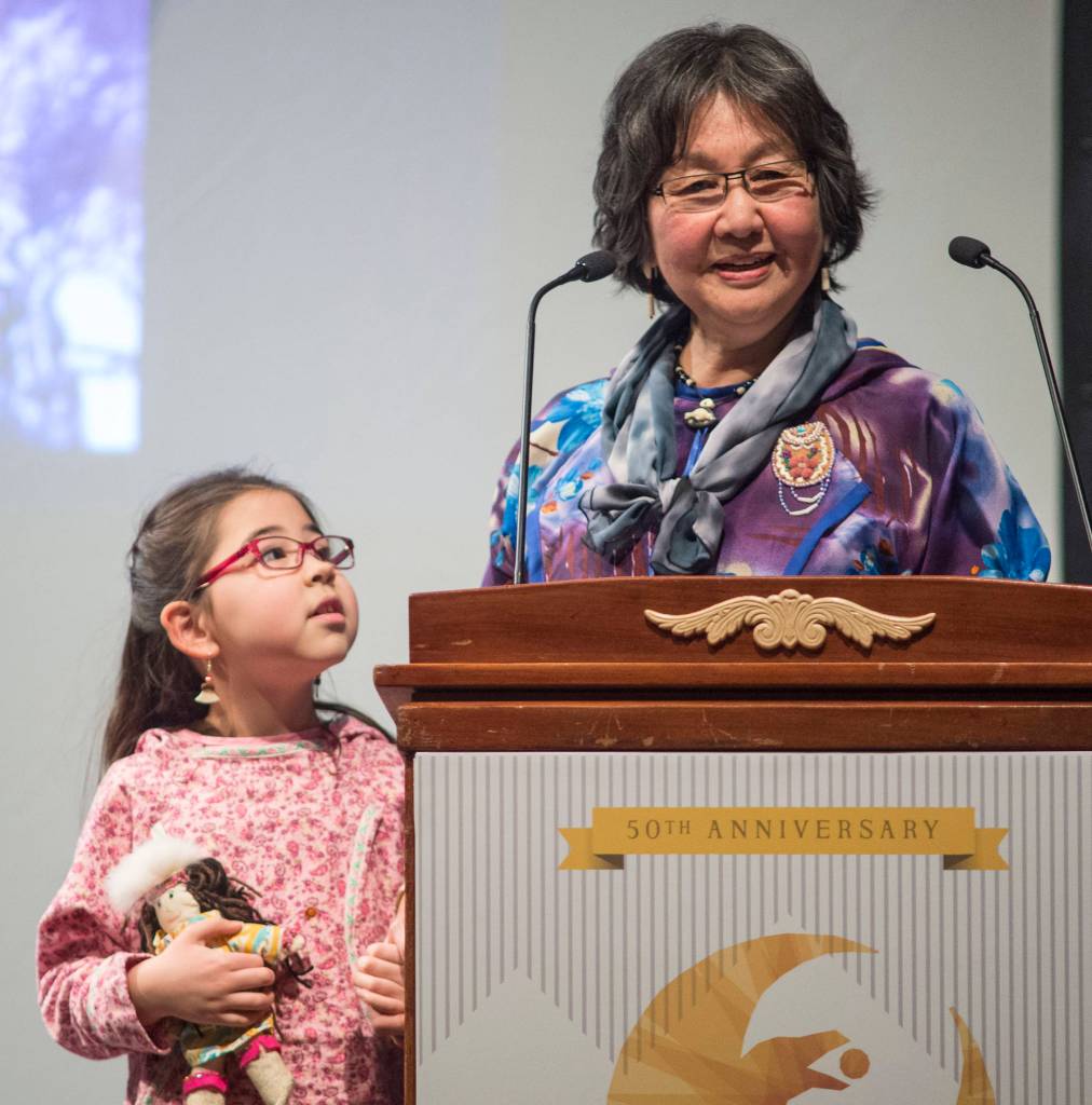 Nita Yurrliq Rearden, of Homer, receives her Arts Education Award with her granddaughter, Paula, 7, at the 2019 Governors Arts and Humanities Awards at the Juneau Arts & Culture Center on Thursday, Feb. 7, 2019. (Michael Penn | Juneau Empire)