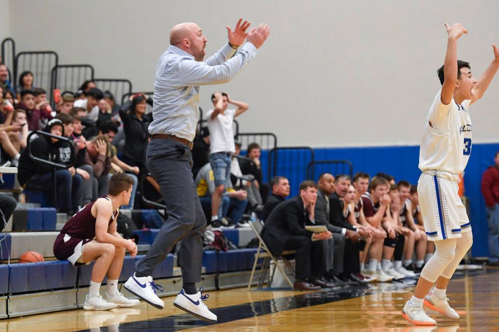 Thunder Mountain coach John Blasco levitates against Ketchikan at TMHS on Friday, Feb. 8, 2019. TMHS won 62-55. (Michael Penn | Juneau Empire)