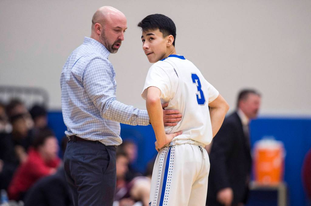 Thunder Mountain coach John Blasco encourages Bryson Echiverri against Ketchikan at TMHS on Friday, Feb. 8, 2019. TMHS won 62-55. (Michael Penn | Juneau Empire)