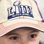 Candyn Clancy, 8, talks about attending the National Football Leagues Super Bowl game this year. (Michael Penn | Juneau Empire)