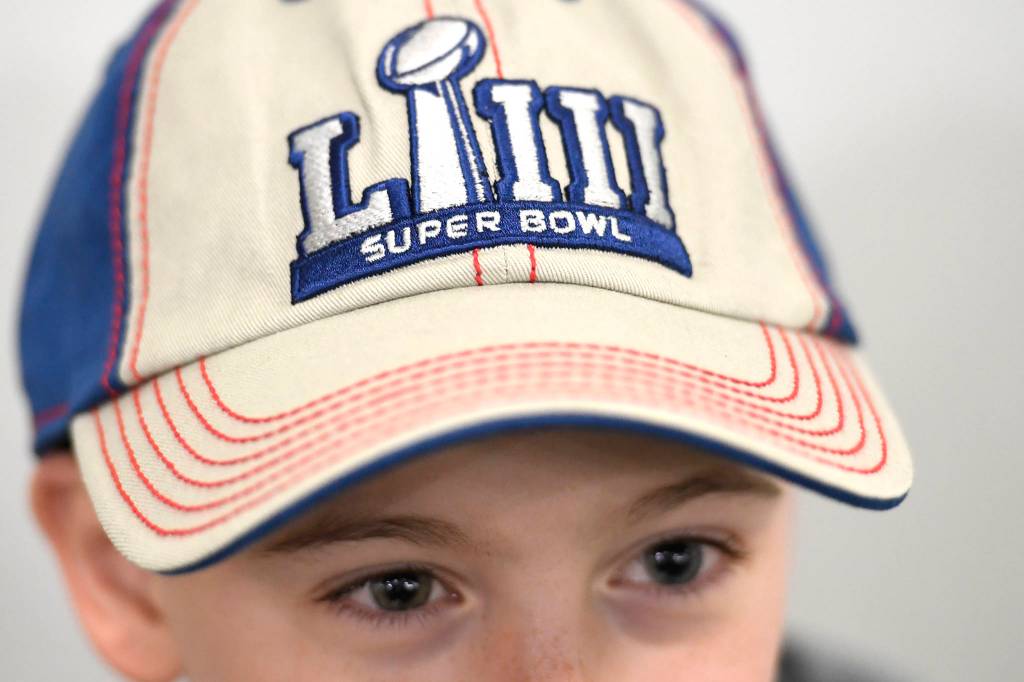 Candyn Clancy, 8, talks about attending the National Football Leagues Super Bowl game this year. (Michael Penn | Juneau Empire)