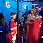 Camdyn Clancy, 8, asks New England Patriots quarterback Tom Brady about dealing with the haters at Super Bowl Opening Night at the State Farm Arena in Atlanta on Monday, Jan. 28, 2019. The Juneau third-grader and Seattle Seahawks superfan won an all-expense paid trip to cover the big game as the grand prize winner of the NFL PLAY 60 Super Kid contest. (Courtesy Photo | Hannah Clancy)