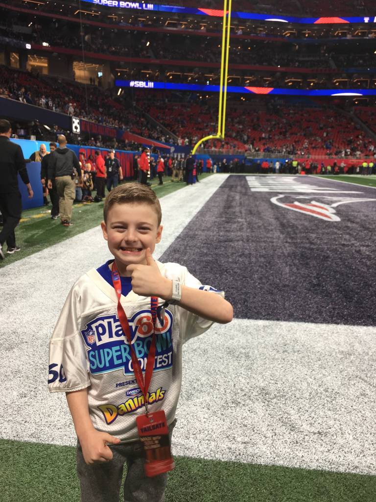 Camdyn Clancy, 8, soaks up the Super Bowl LIII pregame at the Mercedes-Benz Stadium on Sunday, Feb. 3, 2019. The Juneau third-grader and Seattle Seahawks superfan won an all-expense paid trip to cover the big game as the grand prize winner of the NFL PLAY 60 Super Kid contest. (Courtesy Photo | Hannah Clancy)
