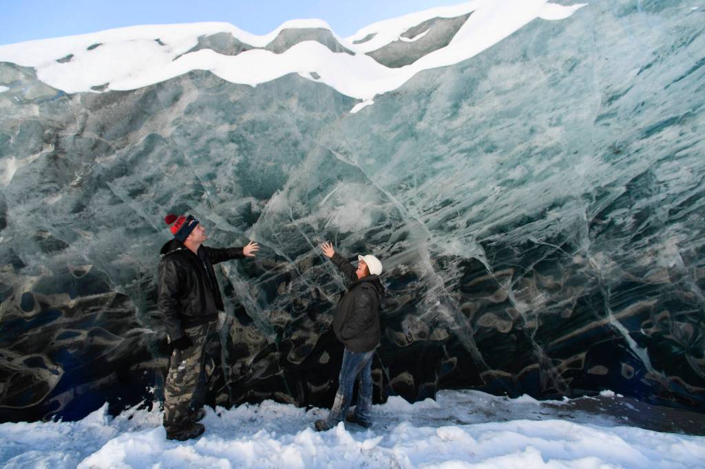 Helen Rice and her husband, Jason Writesel, visiting from Ohio, explore the ice at the Mendenhall Glacier on Monday, Feb. 11, 2019. (Michael Penn | Juneau Empire)