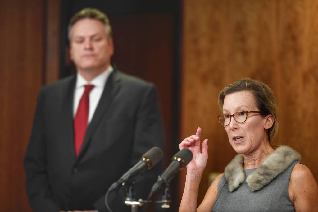 OMB Director Donna Arduin explains the budget as Gov. Mike Dunleavy listens during a press conference to announce the states budget on Wednesday, Feb. 13, 2019. (Michael Penn | Juneau Empire)