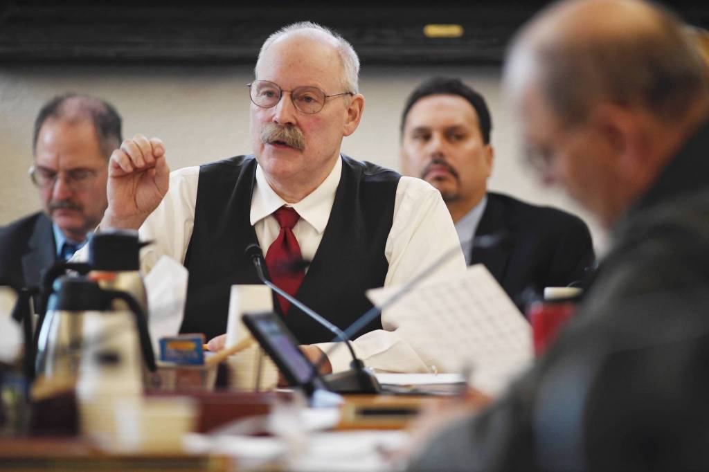 Co-Chair Sen. Bert Stedman, listens to Donna Arduin, Director of the Office of Budget and Management, and Lacey Sanders, Budget Director for OMB, as they present Gov. Mike Dunleavys state budget in front of the Senate Finance Committee at the Capitol on Thursday, Feb. 14, 2019. (Michael Penn | Juneau Empire)