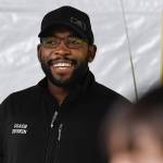 Dwayne Duskin, the new head coach for the Thunder Mountain High School track and field team, talks with students during a pre-season workout at the Wells Fargo Dimond Park Field House on Friday, Feb. 8, 2019. (Michael Penn | Juneau Empire)