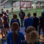 Dwayne Duskin, the new head coach for the Thunder Mountain High School track and field team, talks with students during a pre-season workout at the Wells Fargo Dimond Park Field House on Friday, Feb. 8, 2019. (Michael Penn | Juneau Empire)
