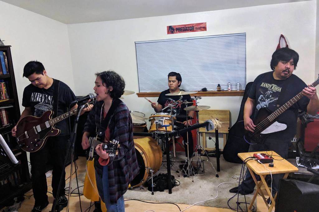 Garden of Agony plays in the Friday familys living room on Wednesday, Feb. 13, 2019. (Ben Hohenenstatt | Capital City Weekly)