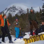 With Panorama Mountain in the background, from left, Lynn Kaluzienski, Elizabeth Berg, Cole Richards and Carl Tape take a break from stomping out a 1-kilometer snowshoe line across the Denali Fault near Cantwell. (Ned Rozell | For the Juneau Empire)