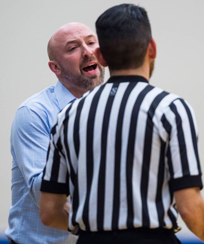 Thunder Mountains coach John Blasco complains to the referee as his team plays Juneau-Douglas at THMS on Friday, Feb. 15, 2019. TMHS won 69-59. (Michael Penn | Juneau Empire)