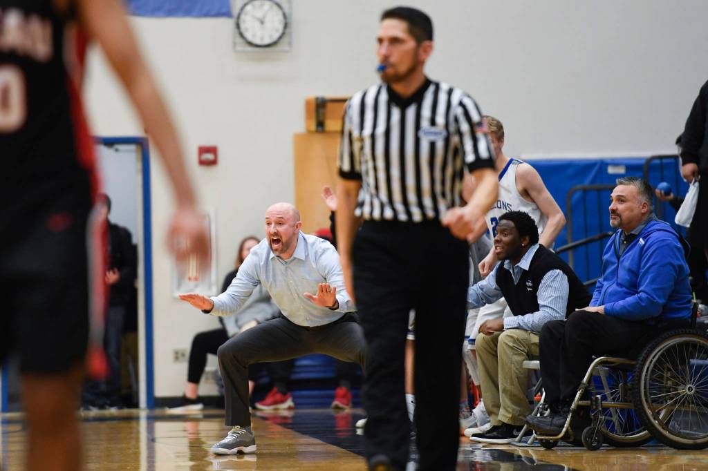 Thunder Mountains coach John Blasco yells to his team as they play Juneau-Douglas at THMS on Friday, Feb. 15, 2019. TMHS won 69-59. (Michael Penn | Juneau Empire)