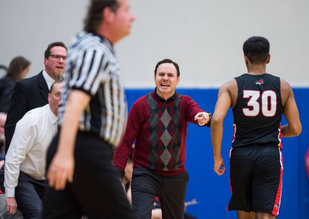 Juneau-Douglas coach Robert Casperson yells to get the referees attention as his team plays Thunder Mountain at THMS on Friday, Feb. 15, 2019. TMHS won 69-59. (Michael Penn | Juneau Empire)