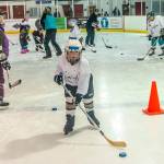 Coach Allison Smith watches a player during a stick handling drill at Treadwell Ice Arena. (Courtesy Photo | Steve Quinn)