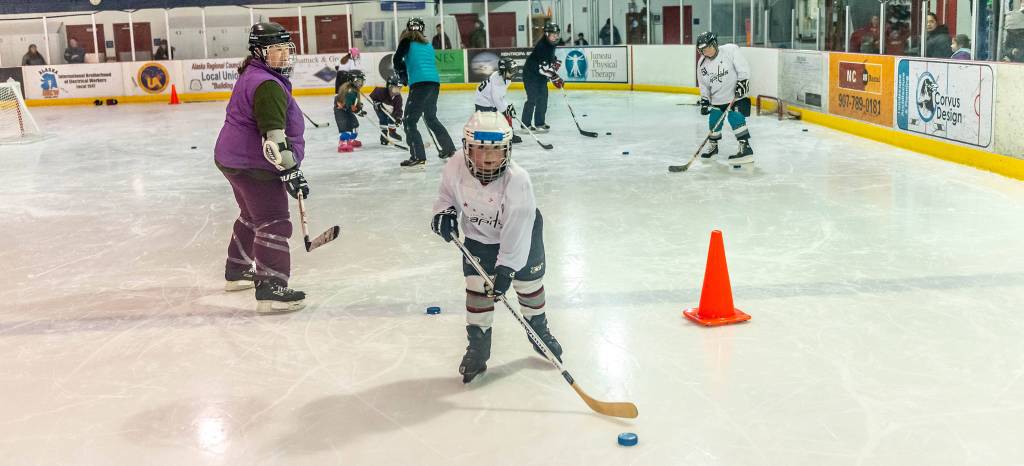 Coach Allison Smith watches a player during a stick handling drill at Treadwell Ice Arena. (Courtesy Photo | Steve Quinn)