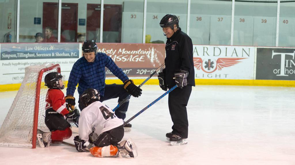 Coaches Alec Venechuk and Darryl Tseu share some laughs with a few JDIA youth players during a recent practice at Treadwell Ice Arena. (Courtesy Photo | Steve Quinn)
